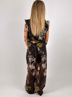 Completo Flora da donna con top smanicato e pantalone morbido a fantasia floreale. vista retro