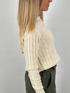 Maglione treccia donna vista aterale