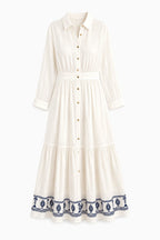 Abito lungo donna bianco in cotone con ricamo decorativo sul fondo - immagine gost