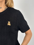 Maglia Teddy Nero  da donna con lavorazione intrecciata e dettaglio ricamato - dettaglio  tessuto