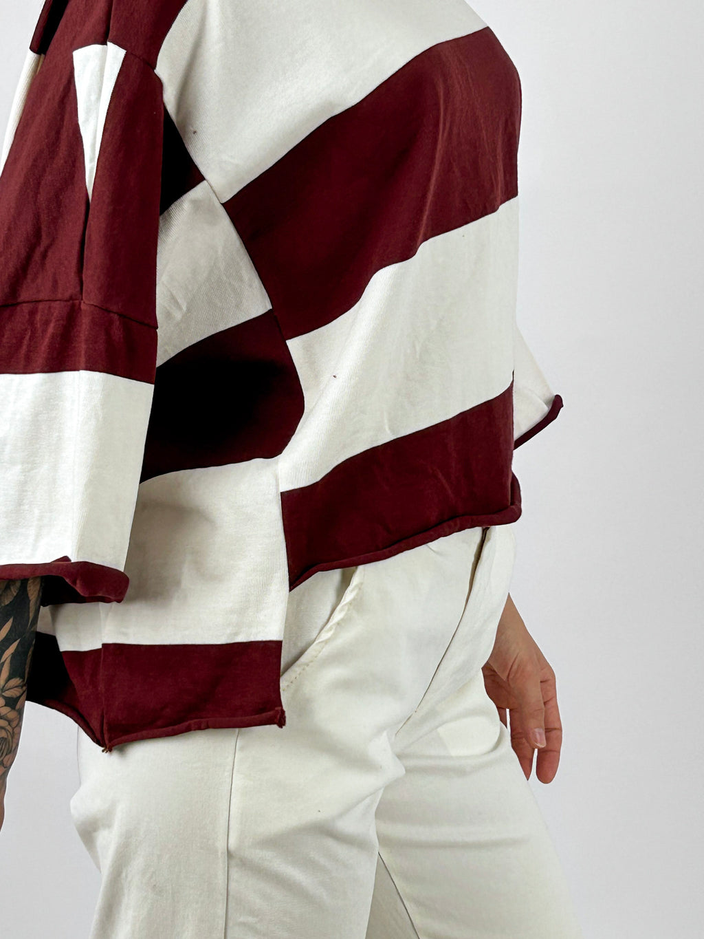 Maglia donna a righe bordeaux e panna - dettaglio fondo